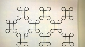 Ornamentti vahvistettu mustalla tussilla